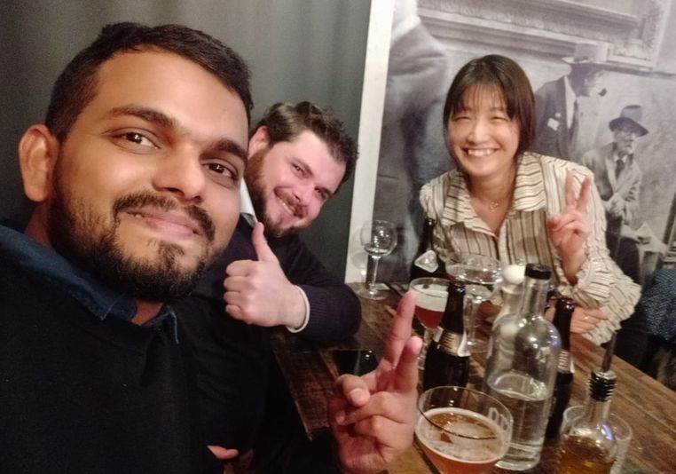 Milan, Flavio, and Naoko at a restaurant