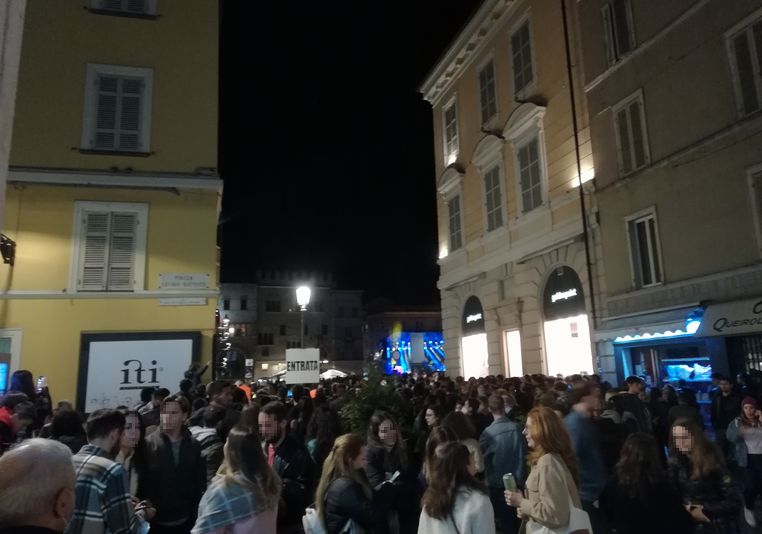people gathering for rock concert